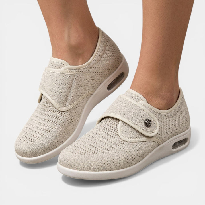 Beige orthopedic walking sneaker side profile with velcro strap and air cushion technology