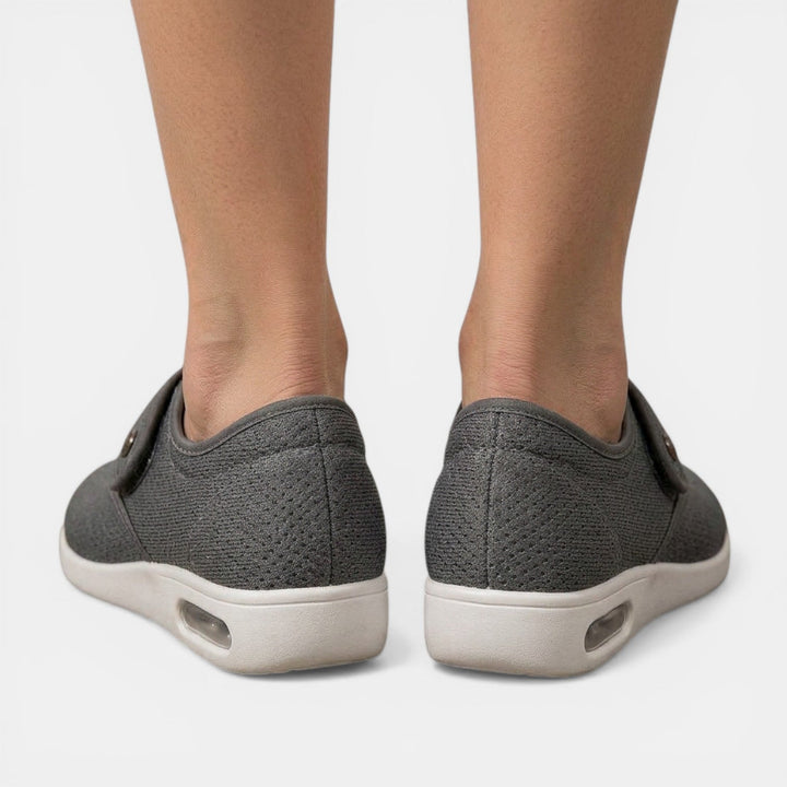 Charcoal gray orthopedic walking sneaker back view showing mesh texture and heel air cushion