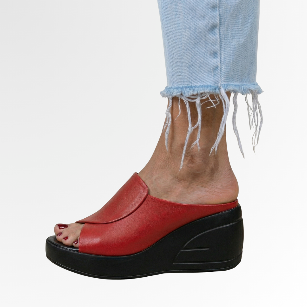 Red peep toe platform wedge sandal featuring black sole and faux leather instep strap