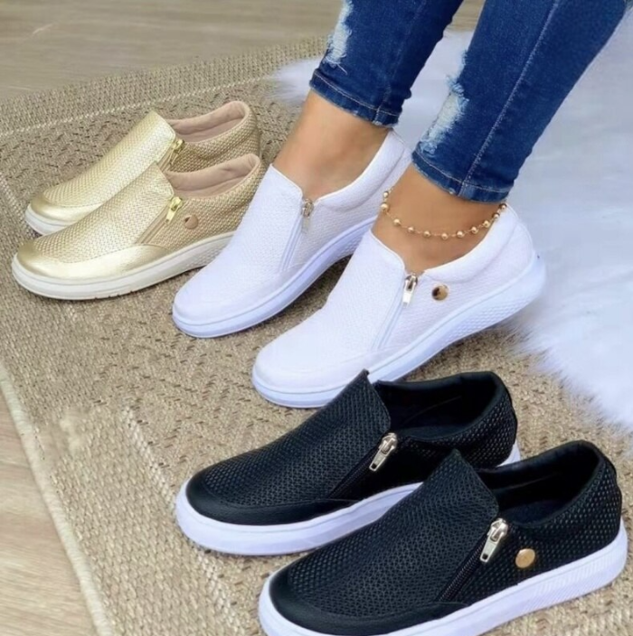 Women's platform slip-on sneakers in black white and gold with side zippers
