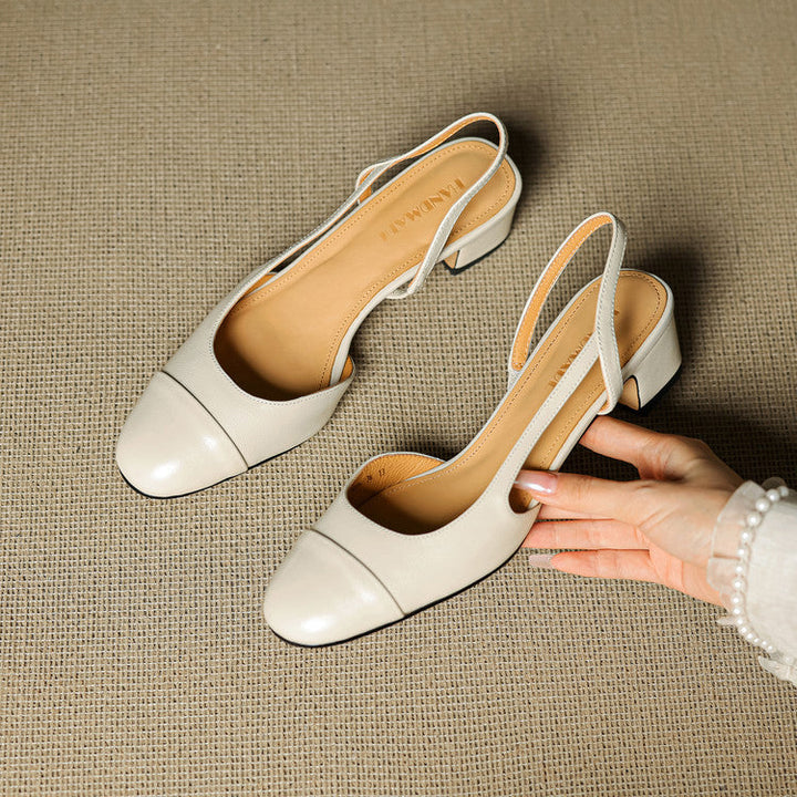 Handmade off-white leather slingback heels with cap-toe construction detail
