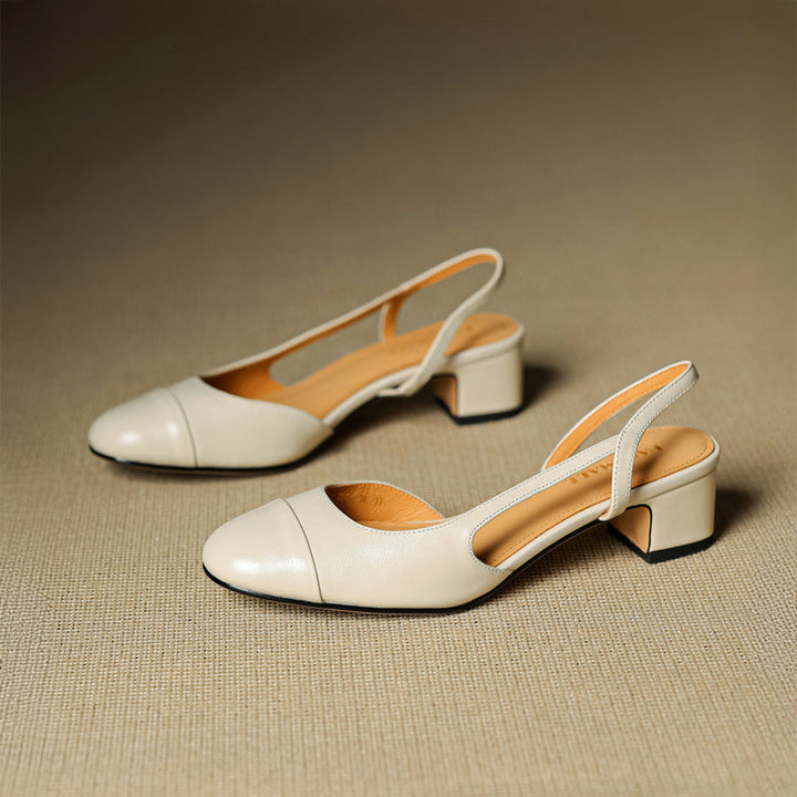 Off-white leather slingback pumps with embossed brand name and block heel