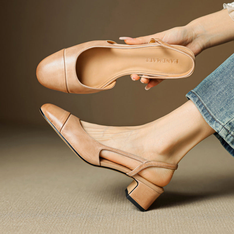 Women's tan leather slingback pumps showing inner sole and side cutout fit