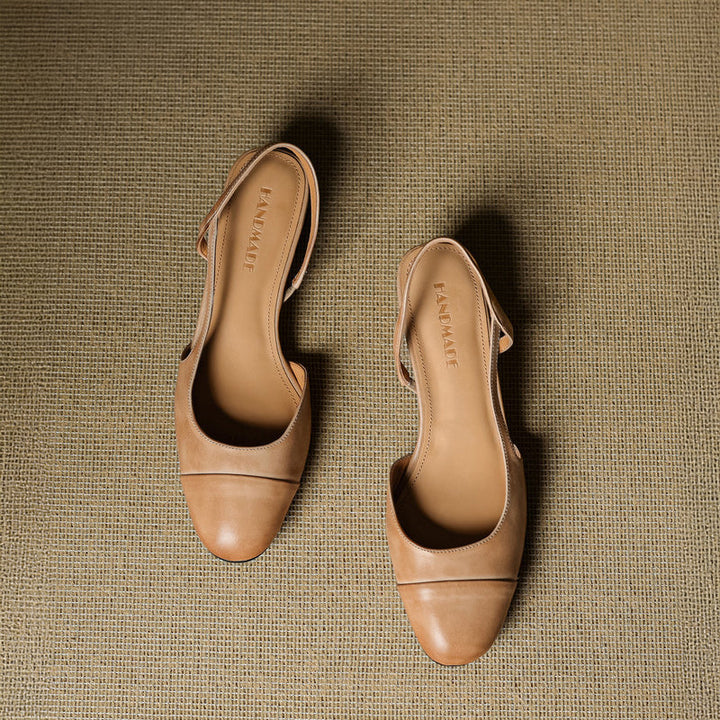 Tan leather slingback pumps overhead view with smooth finish and stitching