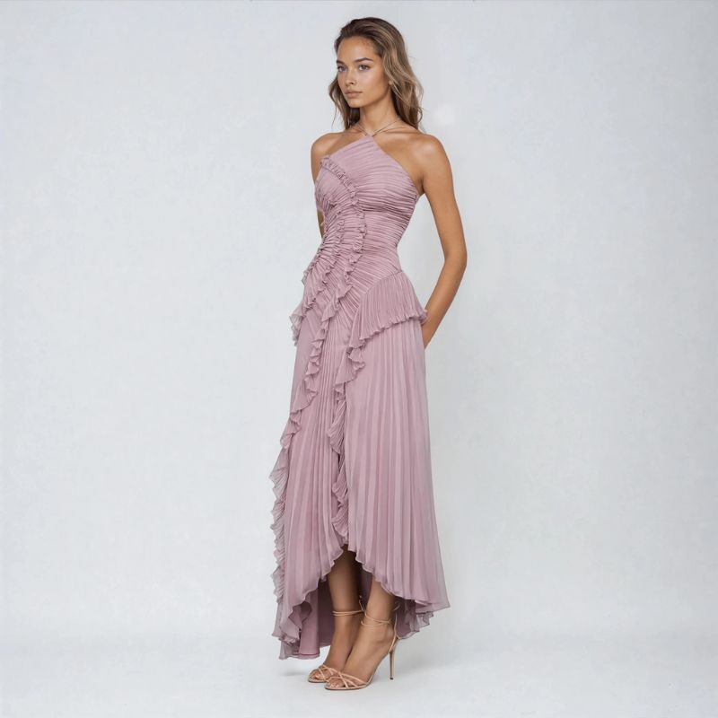 Side view of soft purple asymmetrical halter gown with ruched bodice and ruffle panel