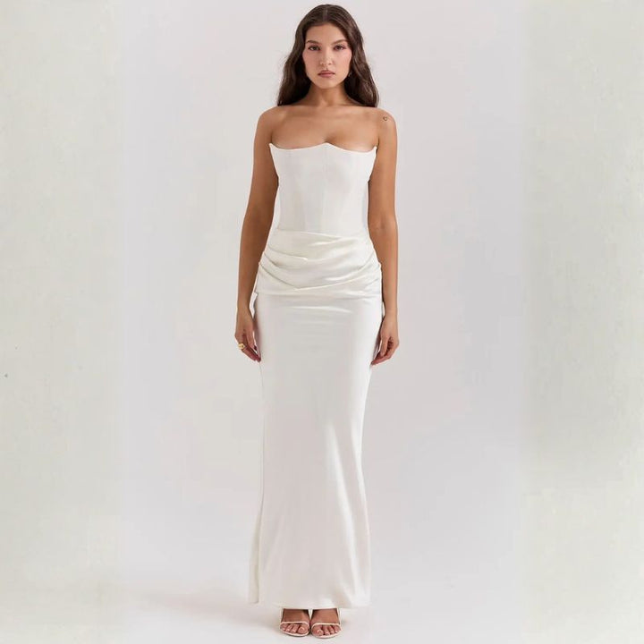 White satin strapless corset gown with draped ruching at the natural waist
