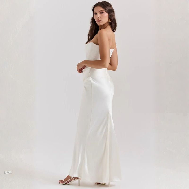 White strapless satin maxi dress profile view with subtle side slit hem