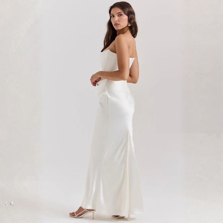 White strapless satin maxi dress profile view with subtle side slit hem