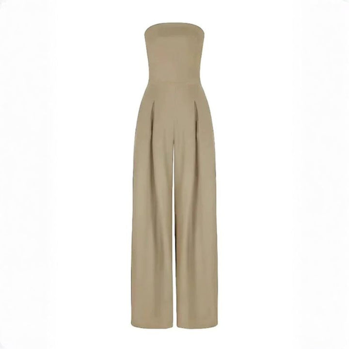 Beige strapless wide-leg jumpsuit featuring vertical front pleats and tailored waist