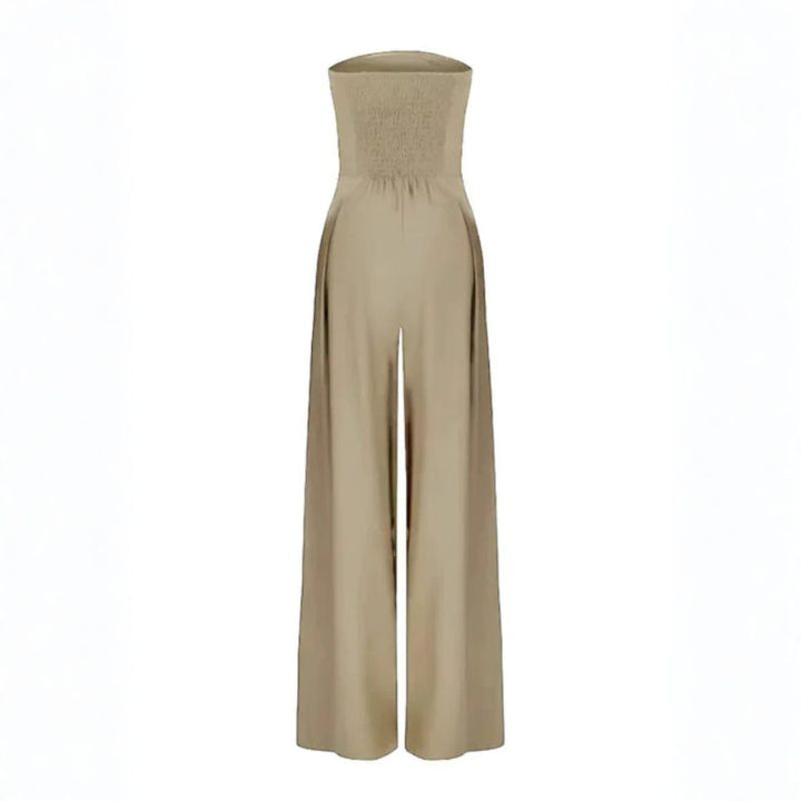 Back view of beige strapless jumpsuit with smocked elasticized bodice panel