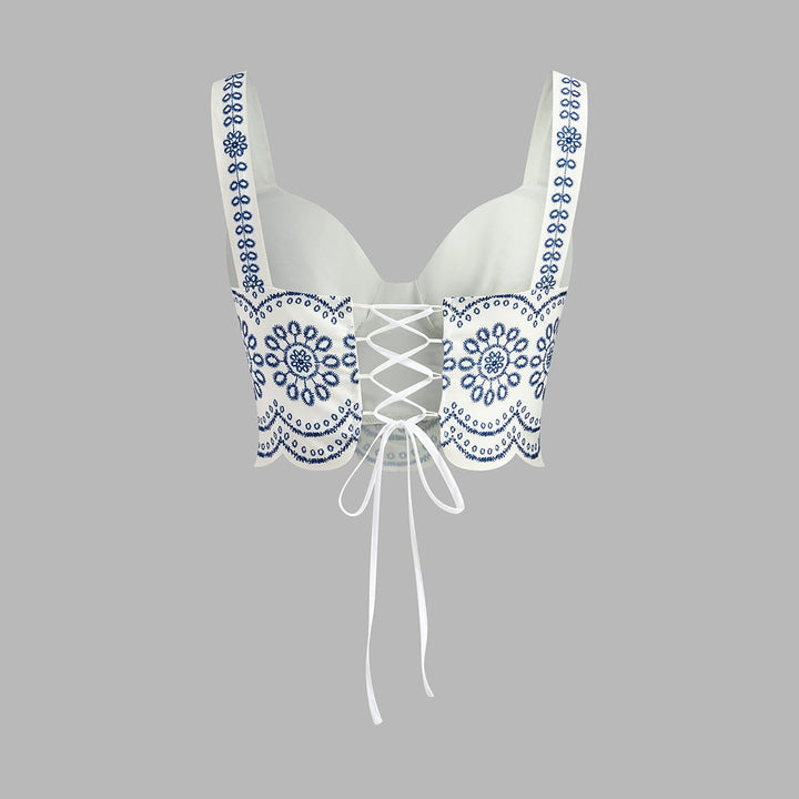 Back view of white bustier crop top with lace-up tie closure