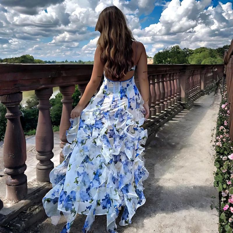 White floral spaghetti strap maxi dress with tiered ruffles and sheer chiffon fabric