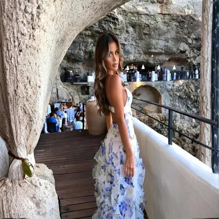 Backless floral print maxi dress with cutout detail and voluminous ruffled skirt