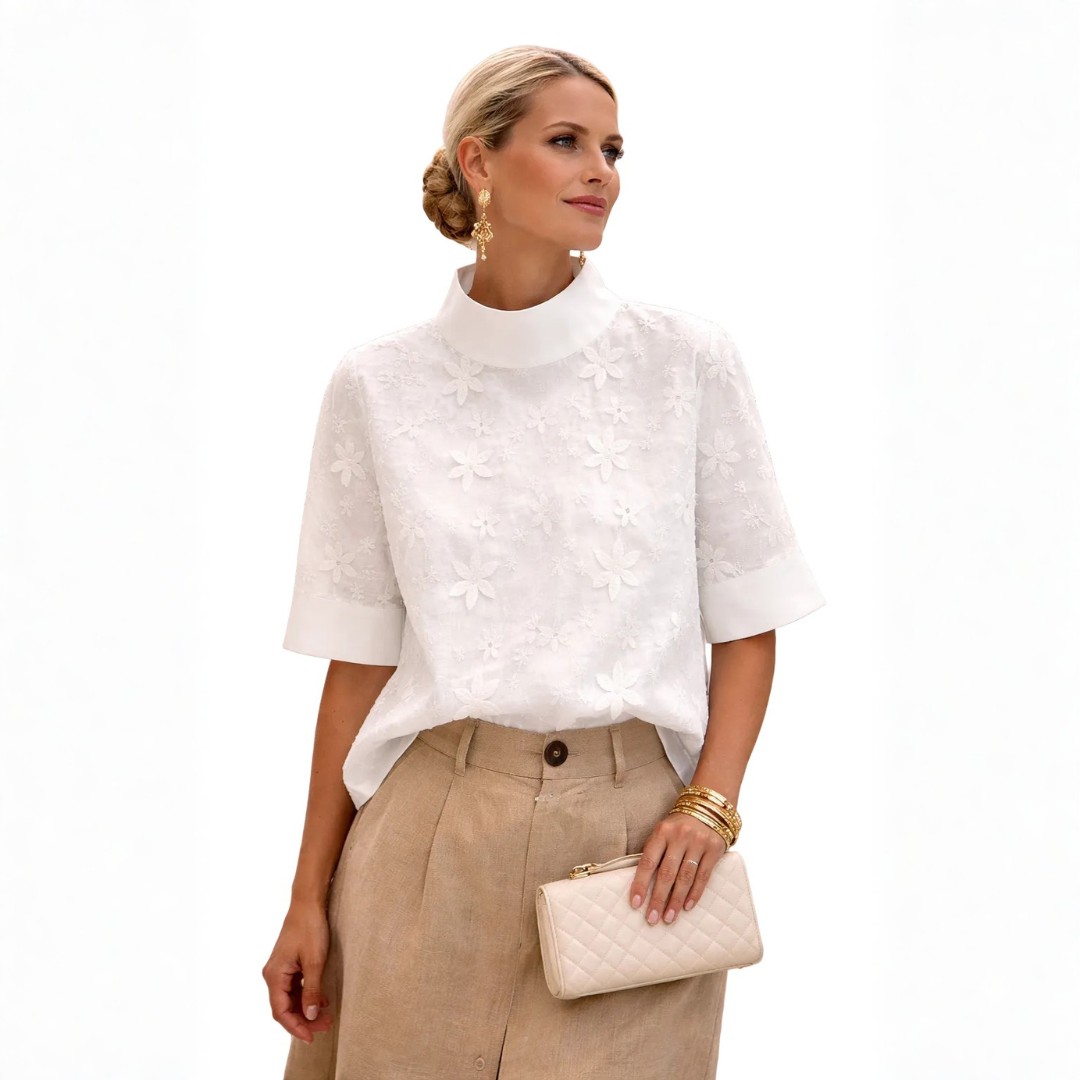 White women's blouse with all-over floral embroidery and mock neckline