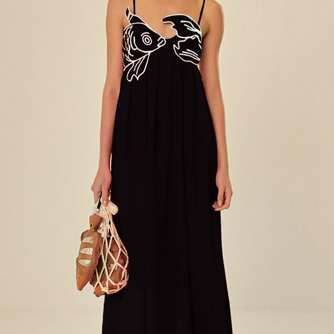 Red pleated maxi dress full front view with sculpted fish details and net bag accessory