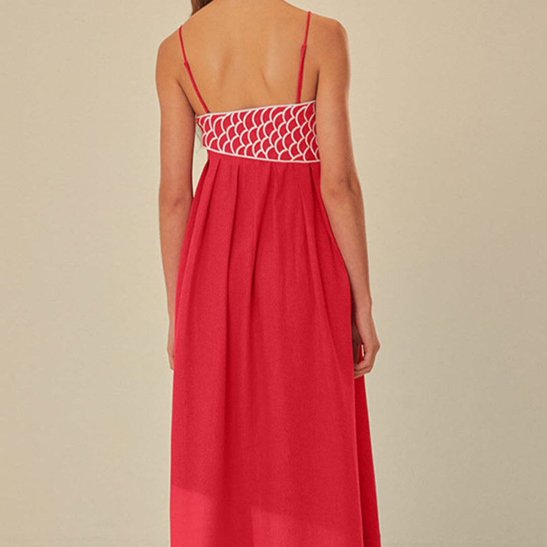 Red pleated maxi dress back view with white embroidered fish-scale appliqué bodice