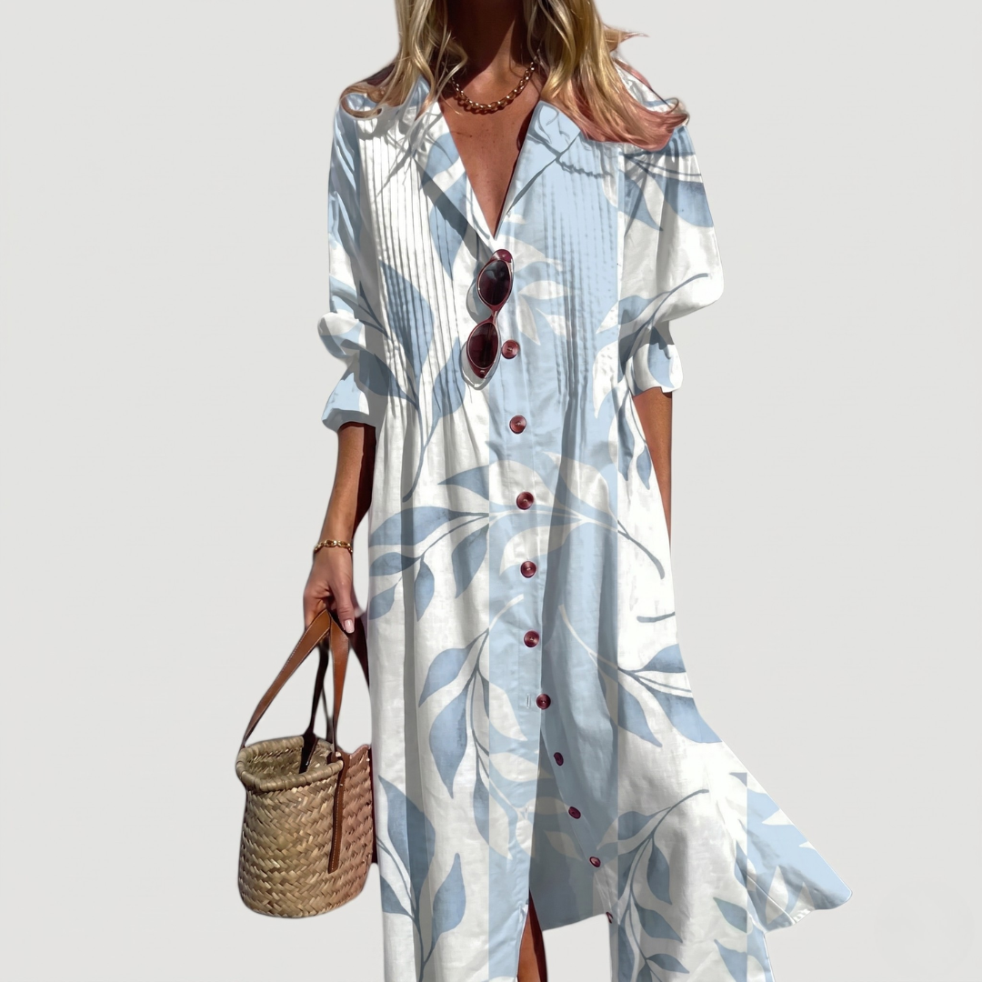 White maxi dress with light blue leaf motifs, collared V-neck pintuck pleated button-front shirt dress