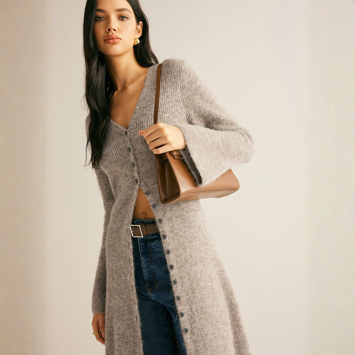 Close-up of women's ribbed knit cardigan showing V-neck and button placket detail