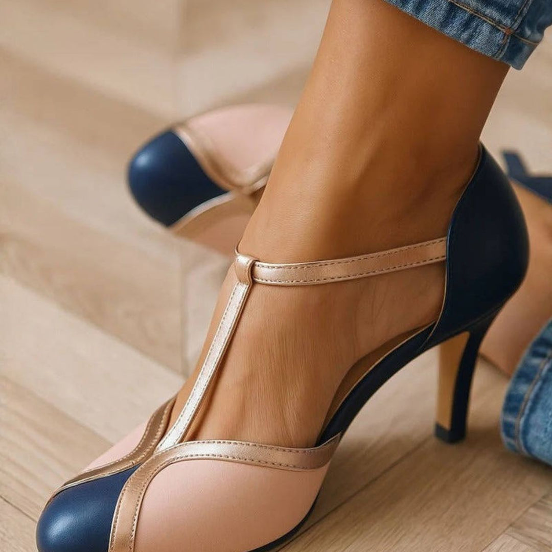 Navy and beige colorblock T-strap heels with gold trim detail