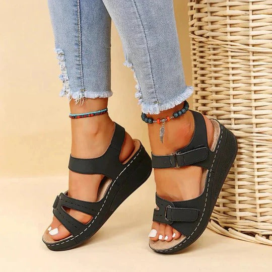 Black women's comfort walking sandals featuring adjustable twin straps and contoured footbed