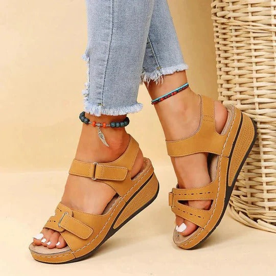 Tan synthetic wedge platform sandals with smooth upper and black textured outsole