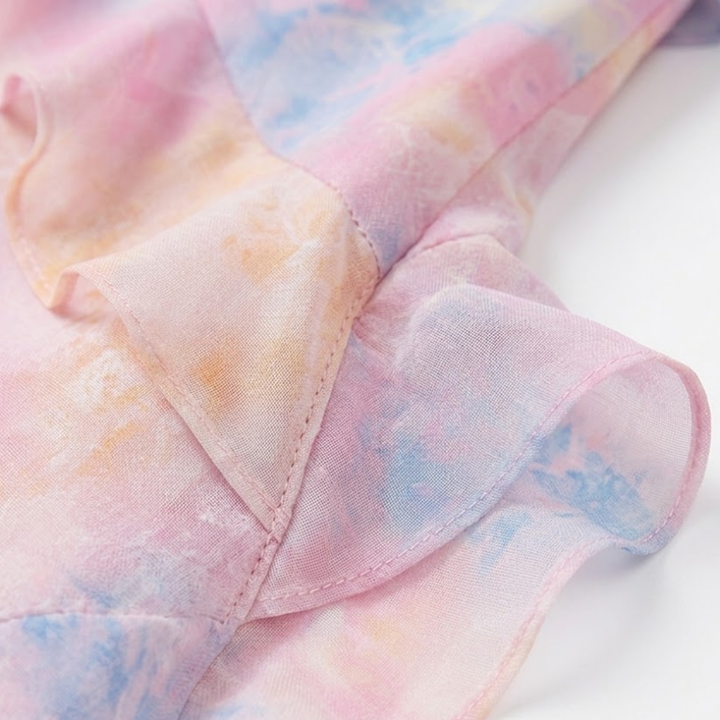 Close-up of lightweight semi-sheer fabric and layered ruffle detail on floral dress