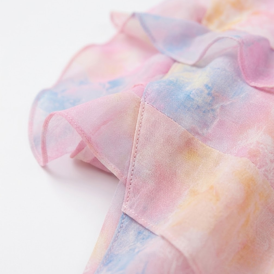 Detail shot of overlapping tiers and watercolor floral pattern on ruffle trim