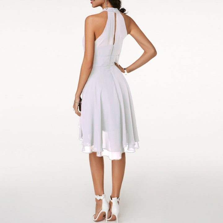 Back view of white halter neck dress showing central slit and fitted bodice