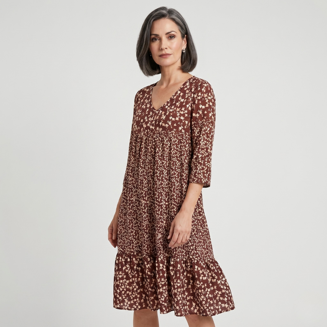 Brown beige floral midi dress with gathered waist on model