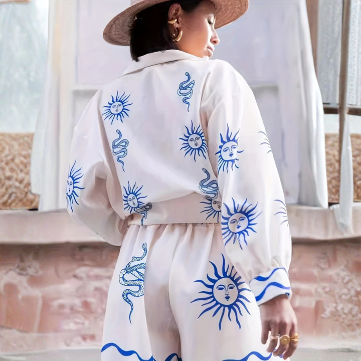 Back view of women's white co-ord set featuring large sun motif and snake print