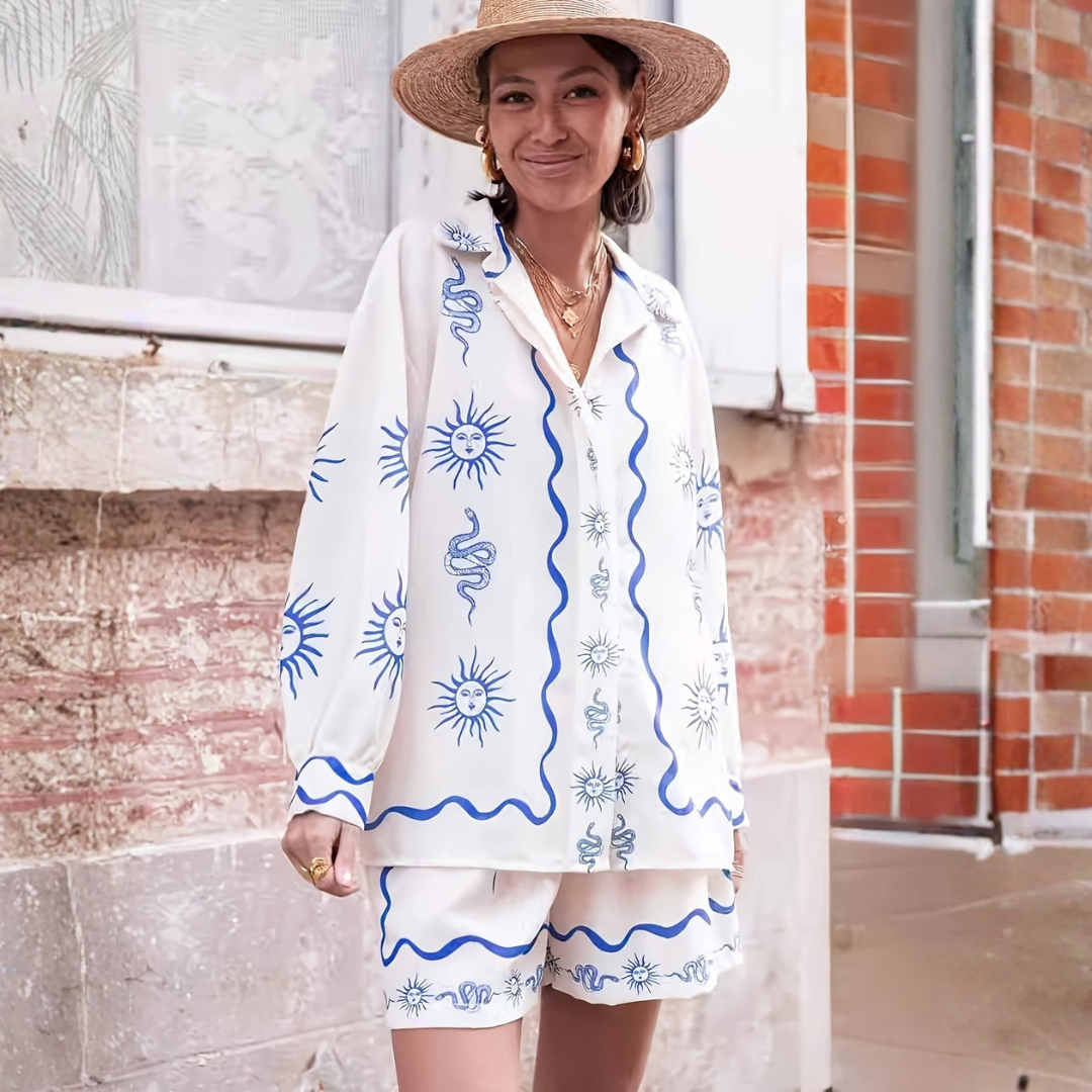 Open front white two-piece summer set with stylized sun face and wave patterns