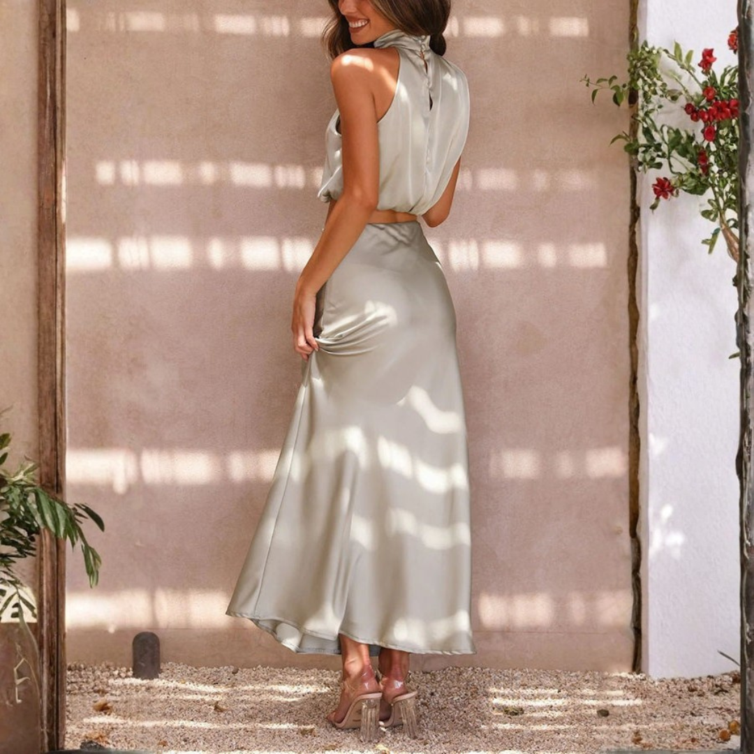 sage green satin two piece set with open back crop top and slit skirt