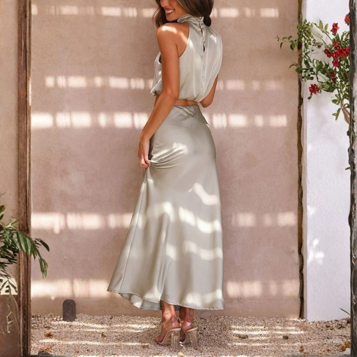 sage green satin two piece set with open back crop top and slit skirt
