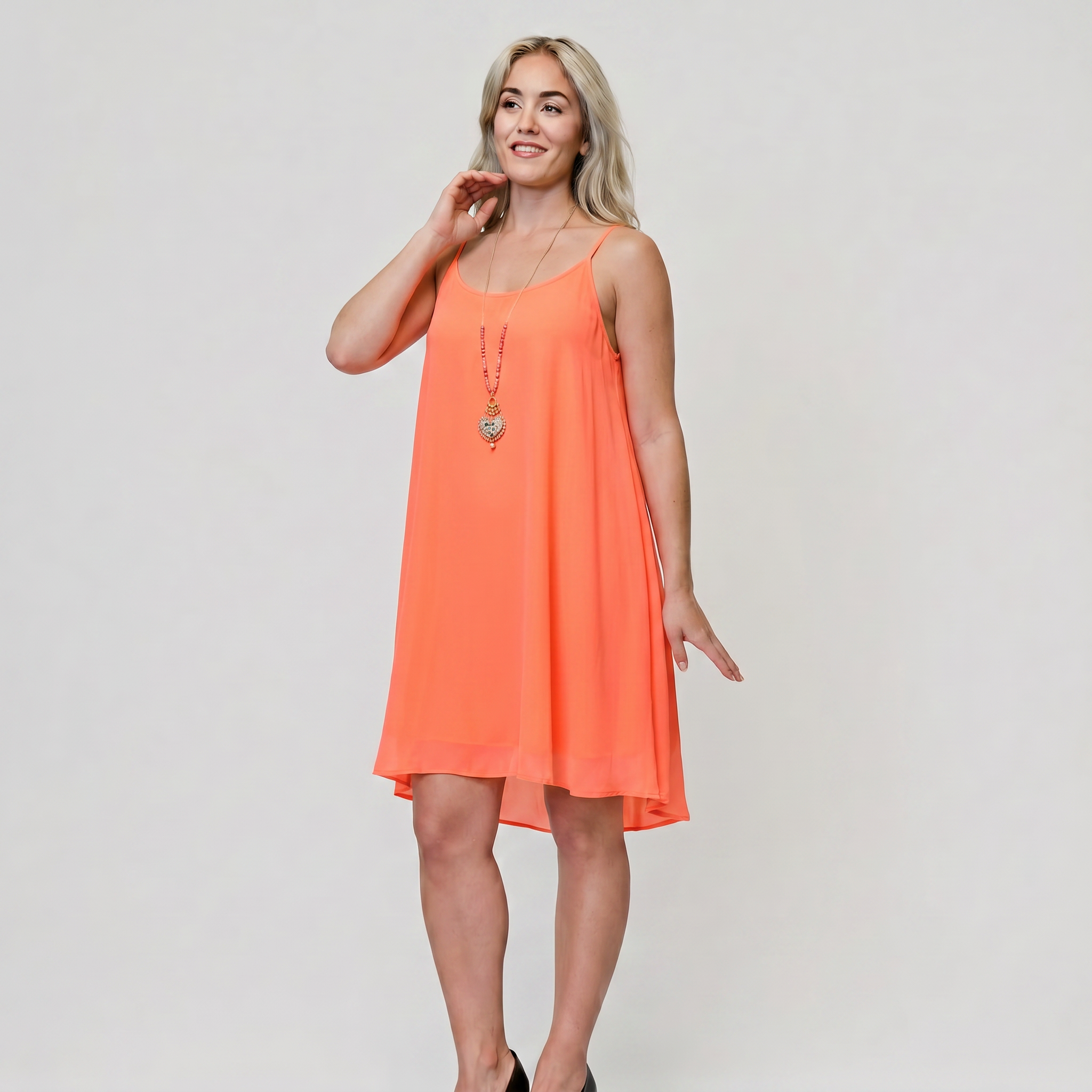 Women's fuchsia sleeveless flared mini dress in lightweight chiffon with high-low hem
